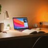 macbook pro on white wooden desk