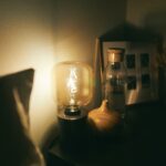 clear glass lamp on black wooden table